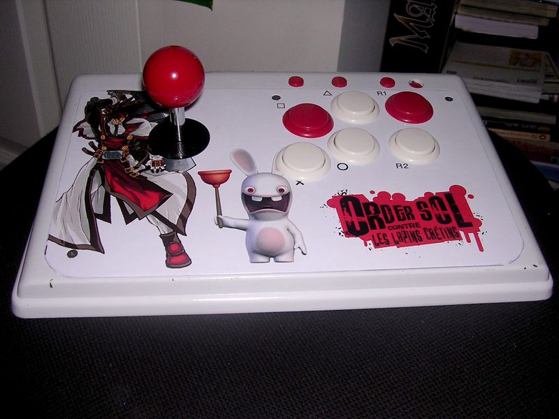An arcade stick figcaption